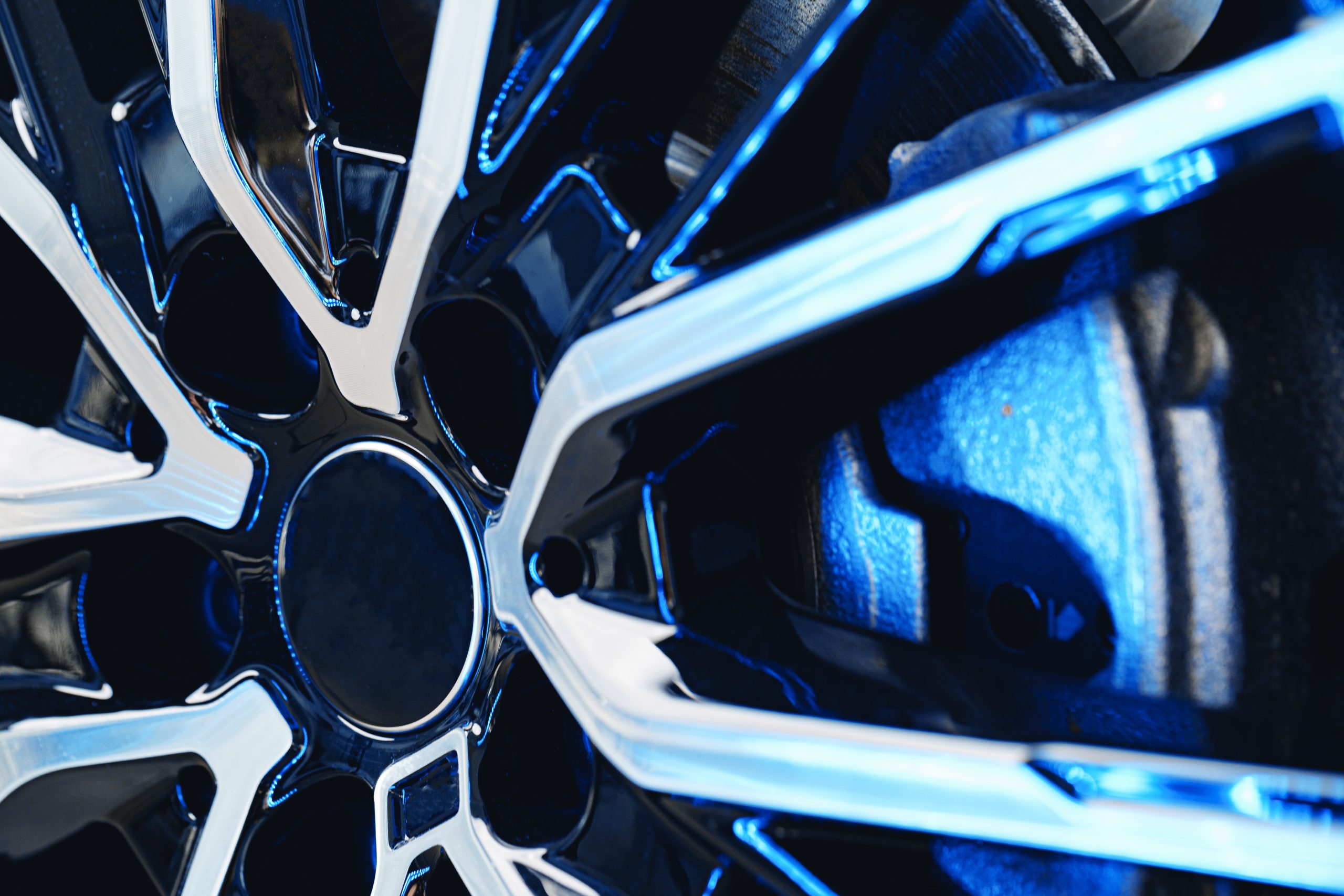 Aluminium rim of luxury car wheel close up photo
